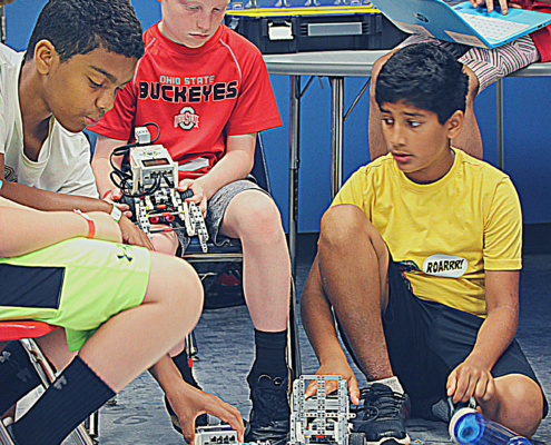 Robotics teams prepare for the Robotics Evolution Challenge.