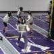 Fencing club with fencers fencing.